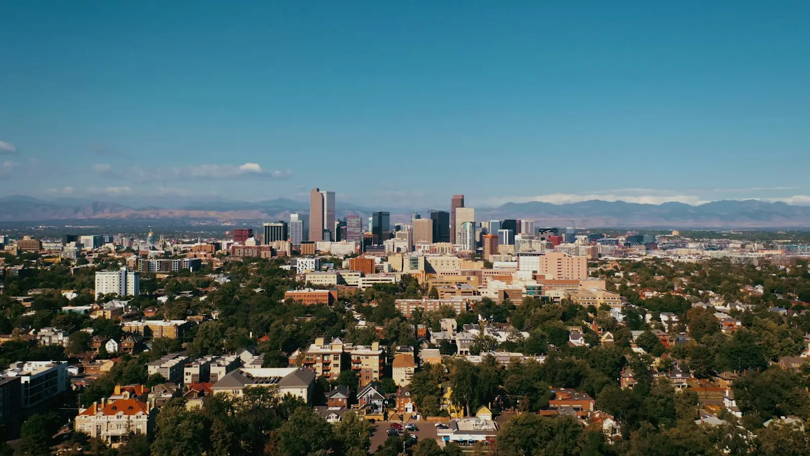 Denver skyline with the Front Range mountains behind it