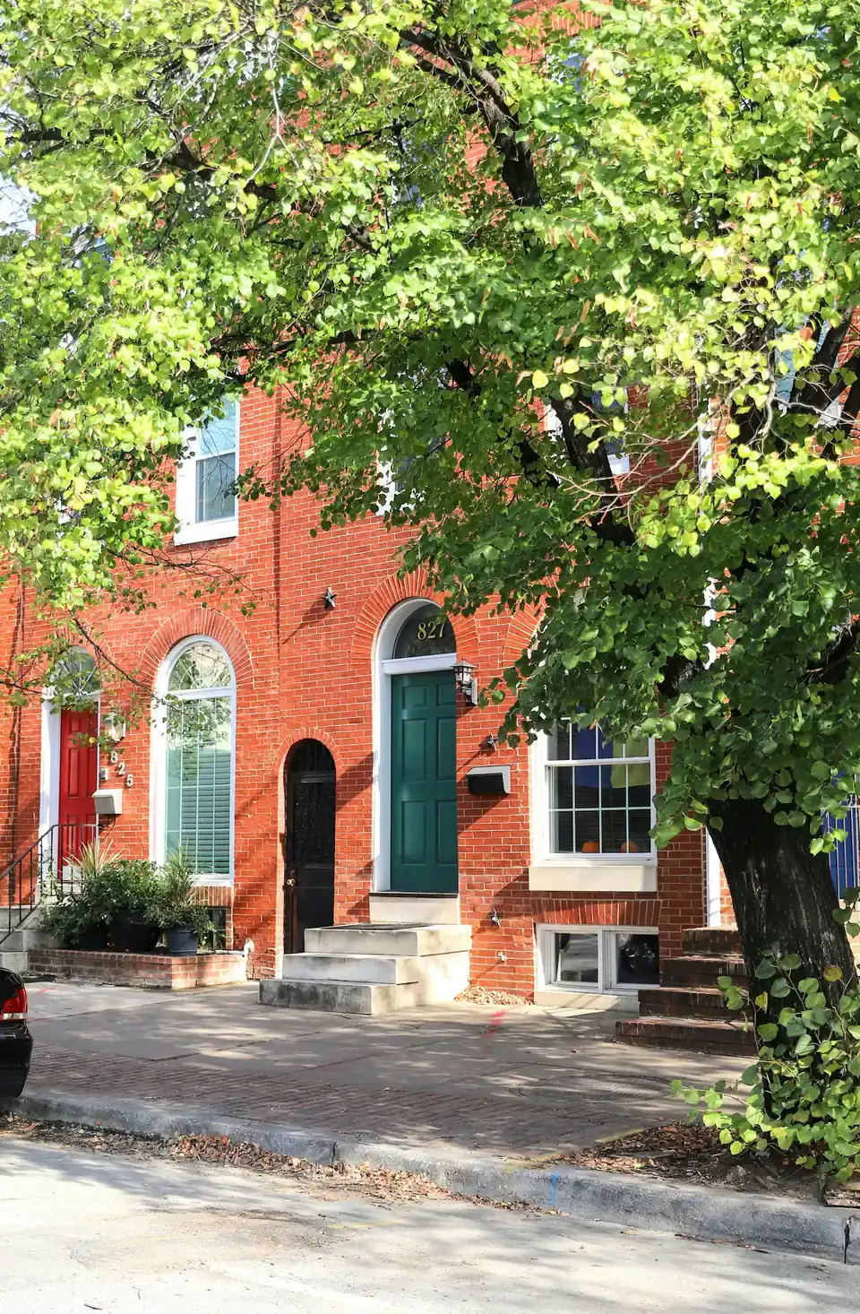 Red brick rowhouses with arched doorways