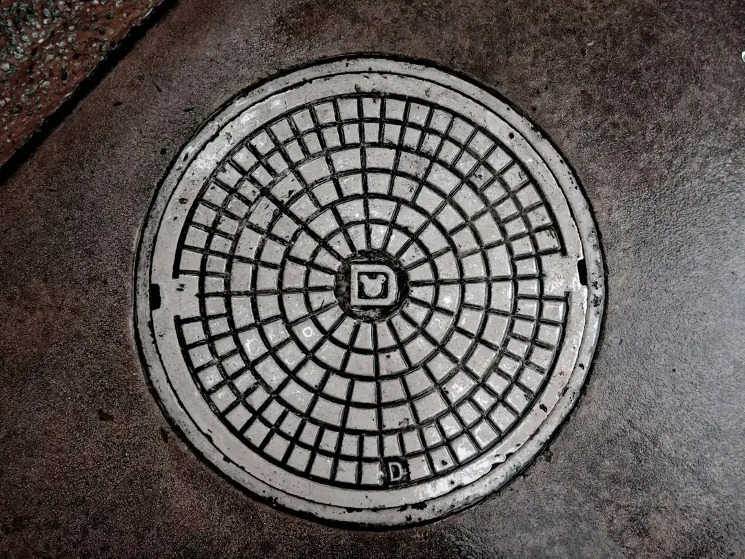 Sewer manhole cover in the street