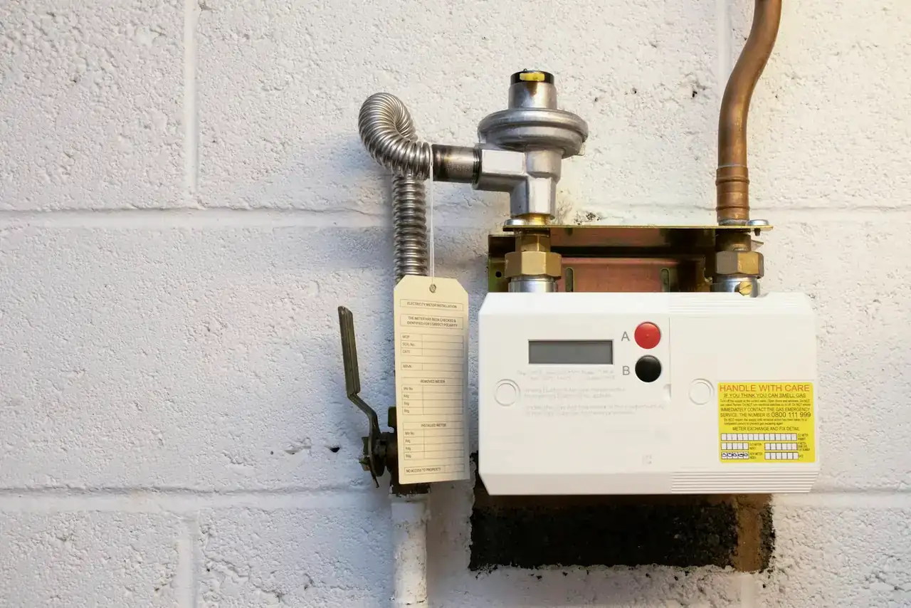 Wall-mounted gas water heater with its gas shutoff valve